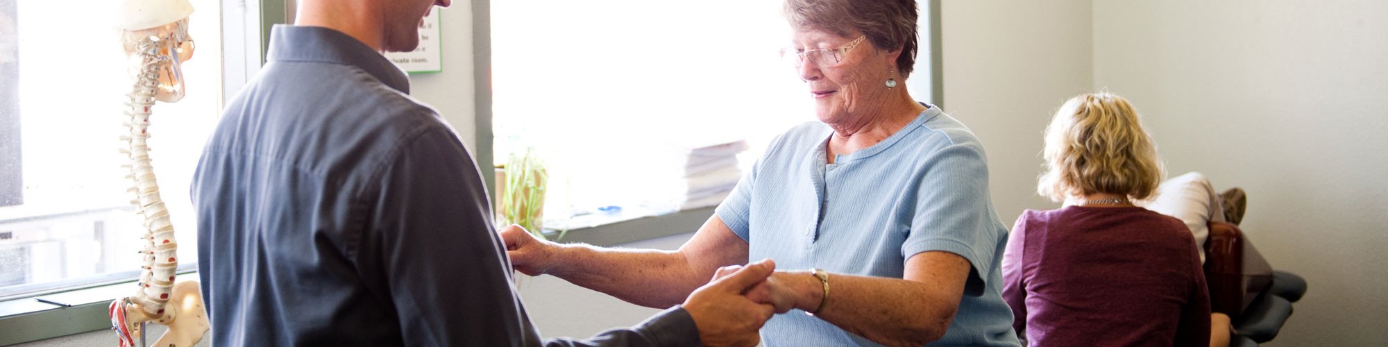 Physical Therapist Chris Allen helps a patient with balance.