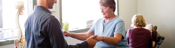 Physical Therapist Chris Allen helps a patient with balance.